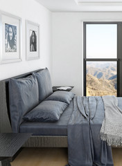 Comfortable bedroom interior with grey double bed