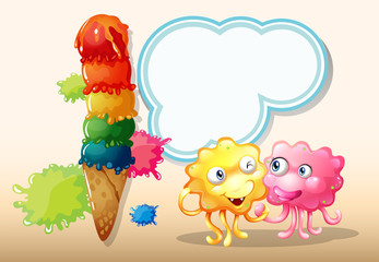 A pink and an orange monster beside the giant icecream