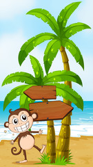 A beach with a smiling elephant near the wooden signboard