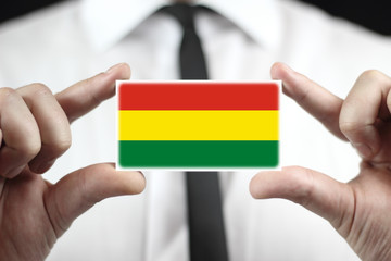 Businessman holding a business card with a Bolivia Flag
