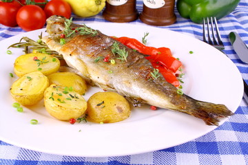 Grilled rainbow trout with potato, red pepper and rosemary