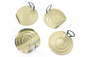 Four tin can lids with opener isolated on white