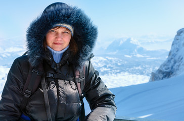 Fototapeta na wymiar Woman on winter mountain background (Austria).