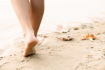 Beach travel - woman walking