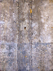 Grunge concrete wall covered with old paint, dust and stains