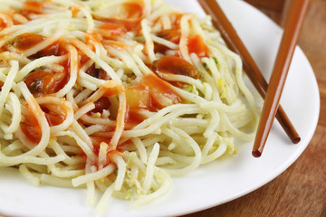 Cooked noodles with chopsticks