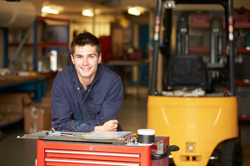 Portrait Of Apprentice Engineer In Factory