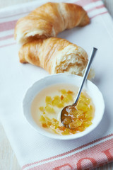Orange jam in a small bowl