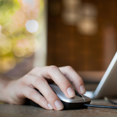 Female hand holding computer mouse