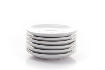 pile of china saucers isolated on a white background