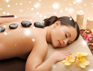 beautiful woman with hot stones