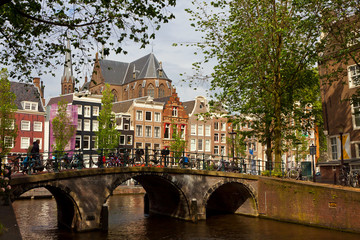 Amsterdam canals with bridge and typical dutch houses