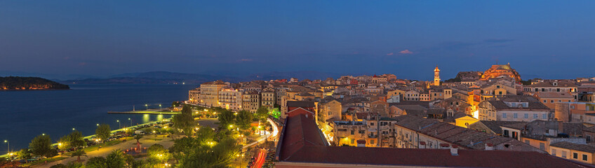 Fototapeta premium Panoramic shot of the citylights of Corfu city at night. Kerkyra
