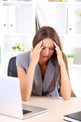 Young business woman in office