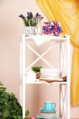 Beautiful white shelves with tableware and decor,