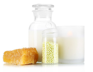 Honey and milk spa with oils and honey isolated on white