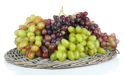 Fresh grape on wicker mat isolated on white