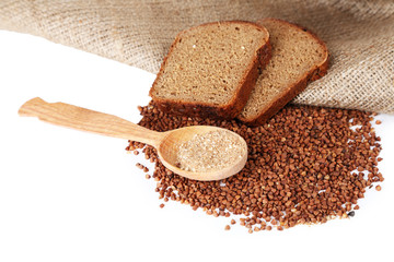 Buckwheat groats bread and wooden spoon closeup