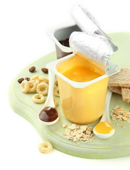 Tasty desserts in open plastic cups and honey combs, fruits and