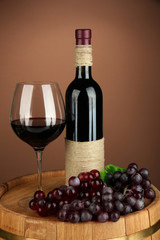 Composition of wine bottle, glass of red wine, grape