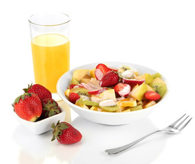 Useful fruit salad of fresh fruits and berries in bowl isolated