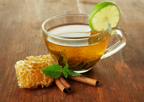 Transparent Cup Of Green Tea With Honey And Cinnamon