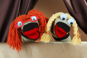 Puppet show on brown background