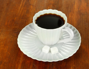 Coffee cup on wooden table close-up