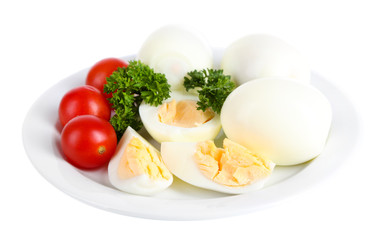 Boiled eggs on plate isolated on white