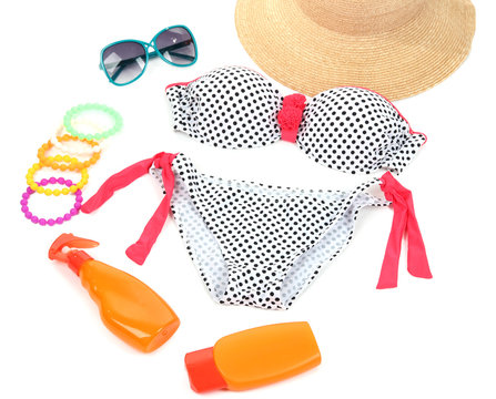 Swimsuit and beach items isolated on white