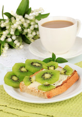 Delicious toast with kiwi on table close-up