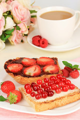 Delicious toast with berries on table close-up