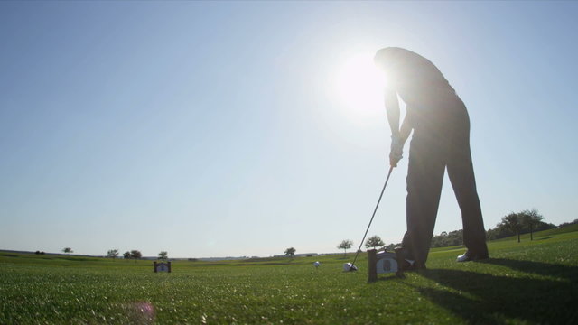 Male Caucasian Golfer Practicing Swing