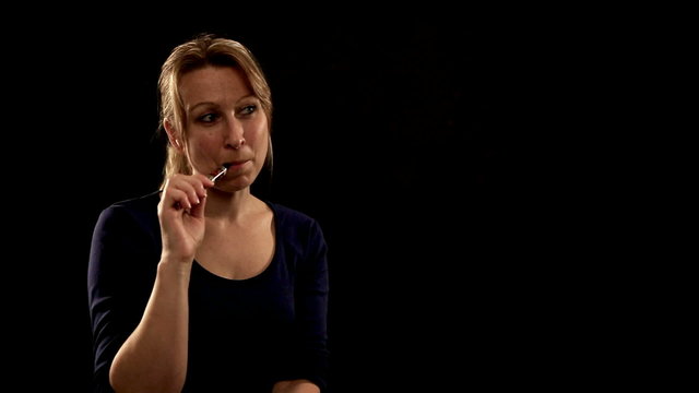 blond pretty woman enjoys her electric cigarette