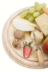 cheese and fruit on a white background