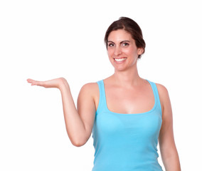 Fototapeta premium Gorgeous young woman holding palm out