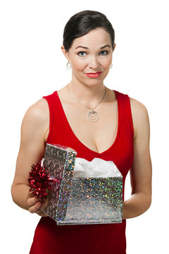 Disappointed woman holding a gift