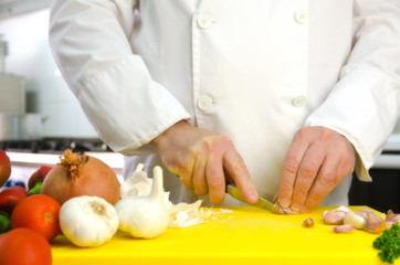 Chef hands with garlic