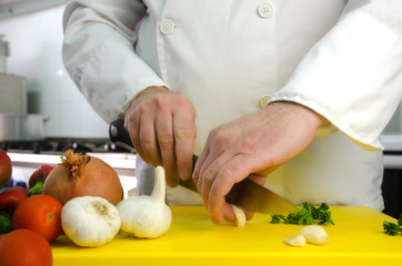 Chef hands with garlic