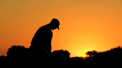 Golfer Driving Off Sunset Golf Resort Fairway