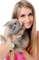 The beautiful woman with a grey rabbit