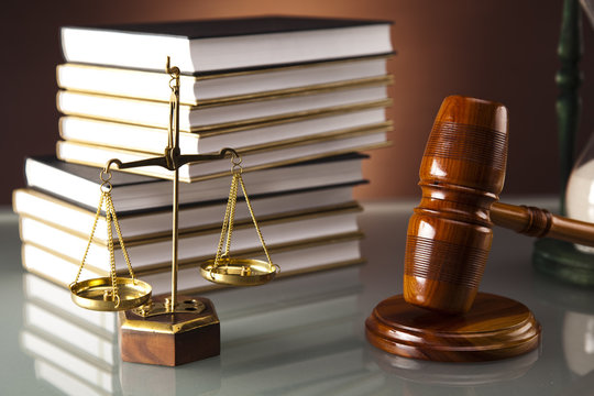 Golden scales of justice, gavel and books
