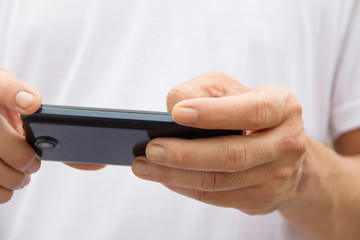 image of man checking his phone