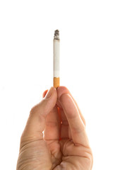 Male hand holding a cigarette on white background