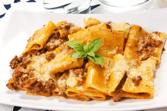 pasta with meat sauce and bechamel in the dish on the table