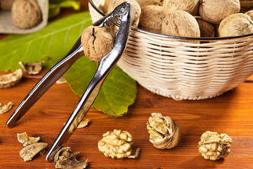 Fototapeta premium walnuts with nutcracker