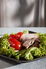 Raw vegetables and sliced roast