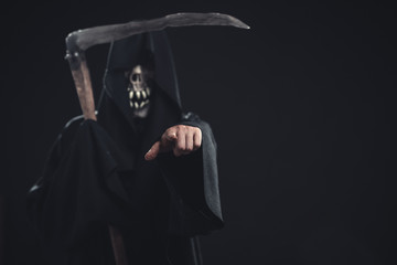 death with scythe standing at night