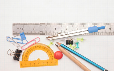 office tools on graph paper