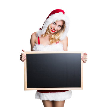 attraktive blonde Weihnachtsfrau mit Kreidetafel